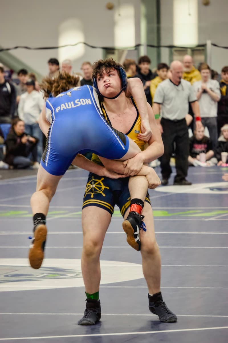 Wrestler lifting his opponent for a takedown
